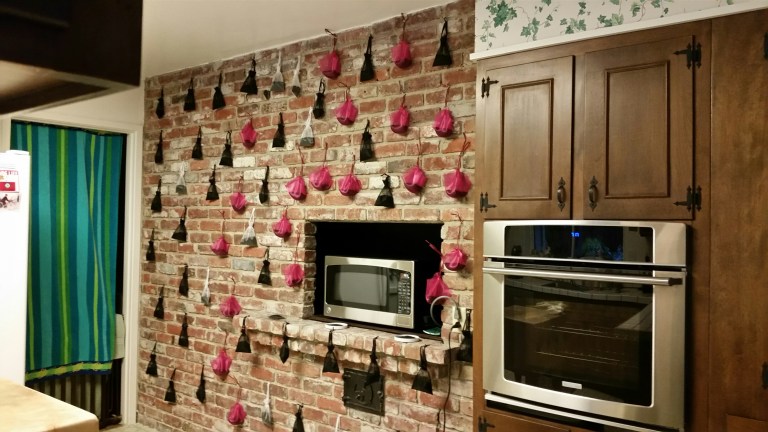 charcoal sachets hanging on wall removing fireplace odor